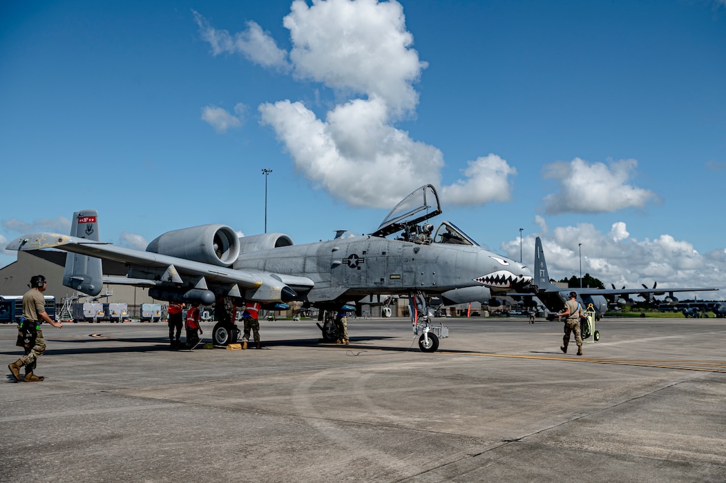 U.S. Air Force Airmen assigned to the 74th Fighter Generation Squadron rearm an A-10C Thunderbolt II at Moody Air Force Base, Georgia, Aug. 28, 2024. Crew chiefs highlighted their capabilities of rearming an A-10C Thunderbolt II in a short amount of time, while Airmen assigned to the 23rd Logistics Readiness Squadron were able to quickly refuel it from an HC-130J Combat King II. (U.S. Air Force photo by Senior Airman Leonid Soubbotine)