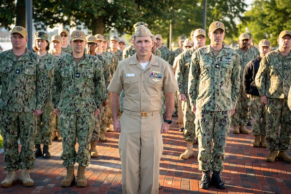 Naval Medical Center Portsmouth (NMCP) active duty and civilian staff members, led by Capt. Brian Feldman, NMCP director/Navy Medicine Readiness and Training Command Portsmouth commander, gathered at Morning Colors to honor the lives lost due to the attacks on the World Trade Center towers, the Pentagon, and the crash of Flight 93 in a Pennsylvania field, 23 years ago, Sept. 11.