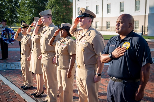 Naval Medical Center Portsmouth (NMCP) active duty and civilian staff members, led by Capt. Brian Feldman, NMCP director/Navy Medicine Readiness and Training Command Portsmouth commander, gathered at Morning Colors to honor the lives lost due to the attacks on the World Trade Center towers, the Pentagon, and the crash of Flight 93 in a Pennsylvania field, 23 years ago, Sept. 11.