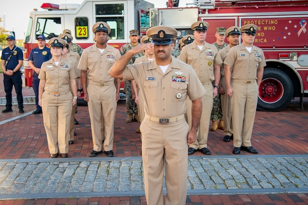 Naval Medical Center Portsmouth (NMCP) active duty and civilian staff members, led by Capt. Brian Feldman, NMCP director/Navy Medicine Readiness and Training Command Portsmouth commander, gathered at Morning Colors to honor the lives lost due to the attacks on the World Trade Center towers, the Pentagon, and the crash of Flight 93 in a Pennsylvania field, 23 years ago, Sept. 11.