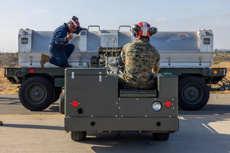 U.S. Marine Corps Cpl. Danny Santelmo, left, and Cpl. Joseph Odo, both aircraft ordnance technicians with Marine Fighter Attack Squadron (VMFA) 232, Marine Aircraft Group 11, 3rd Marine Aircraft Wing, unload an AGM-158A joint air-to-surface standoff missile during the AGM-158A validation and verification at Marine Corps Air Station Miramar