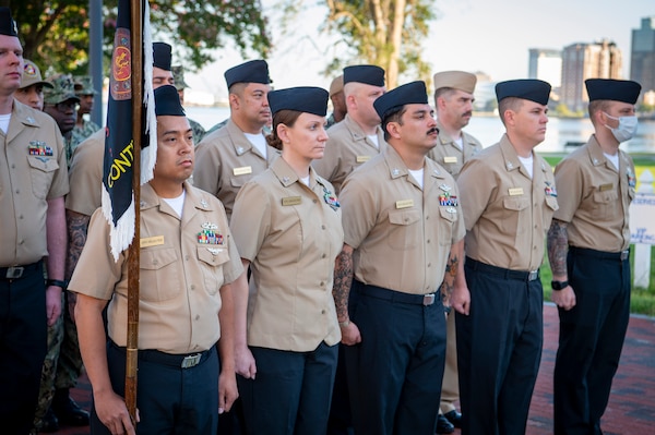 Naval Medical Center Portsmouth (NMCP) active duty and civilian staff members, led by Capt. Brian Feldman, NMCP director/Navy Medicine Readiness and Training Command Portsmouth commander, gathered at Morning Colors to honor the lives lost due to the attacks on the World Trade Center towers, the Pentagon, and the crash of Flight 93 in a Pennsylvania field, 23 years ago, Sept. 11.