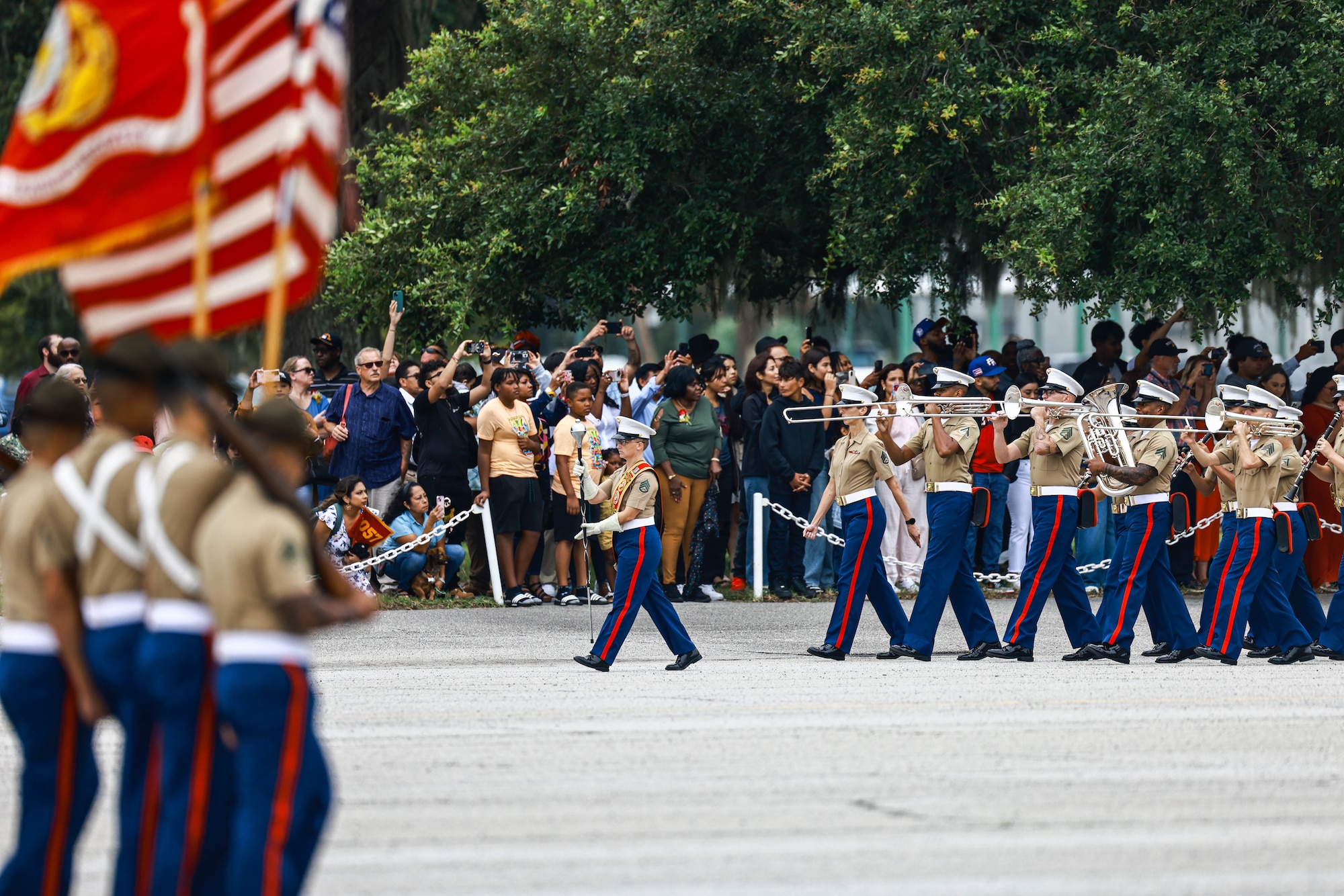 Parris Island Marine Band leads the new Marines marching across the Peatross Parade Deck playing Semper Fidelis during the pass and review. Photo taken by Cpl. Alegria at the Graduation Ceremony on 20240906.