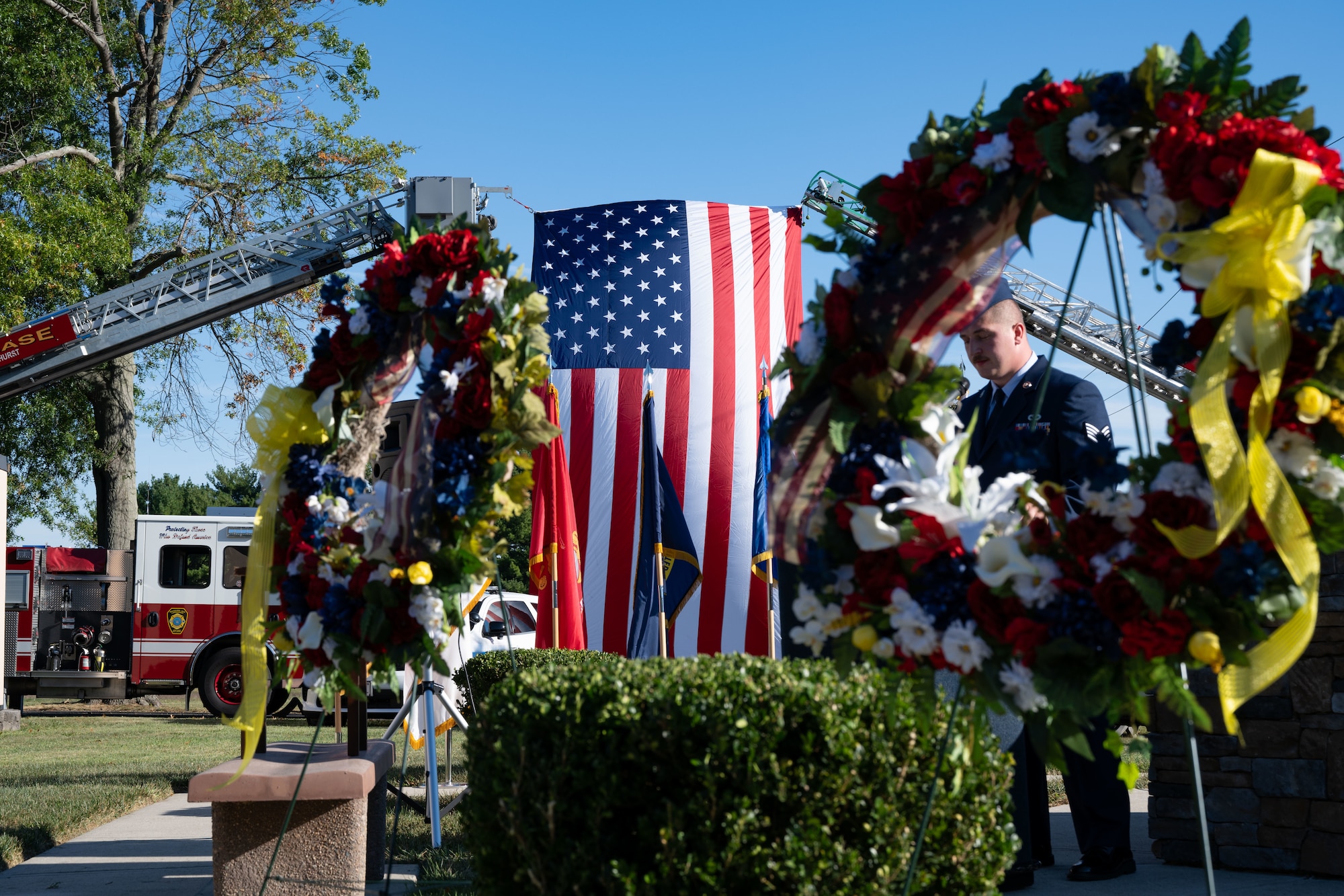 U.S. Air Force Staff Sgt. Connor Octeau, 87th Civil Engineer Squadron crew chief, narrates the 9/11 remembrance ceremony at Joint Base McGuire-Dix-Lakehurst, N.J., Sept. 11, 2024. The annual ceremony honors the nearly three thousand lives lost to the terrorist attacks that took place on September 11, 2001. (U.S. Air Force photo by Aidan Thompson)