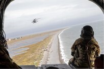 A 10th Special Forces Group (Airborne) Green Beret observes an incoming CH-47 Chinook in support of Operation Polar Dagger in Wales, Alaska, Aug. 22, 2024. SOCNORTH demonstrated throughout Operation Polar Dagger SOF’s ability to disrupt irregular and conventional threats and erode competitors’ confidence to hold the North American Arctic at risk.
