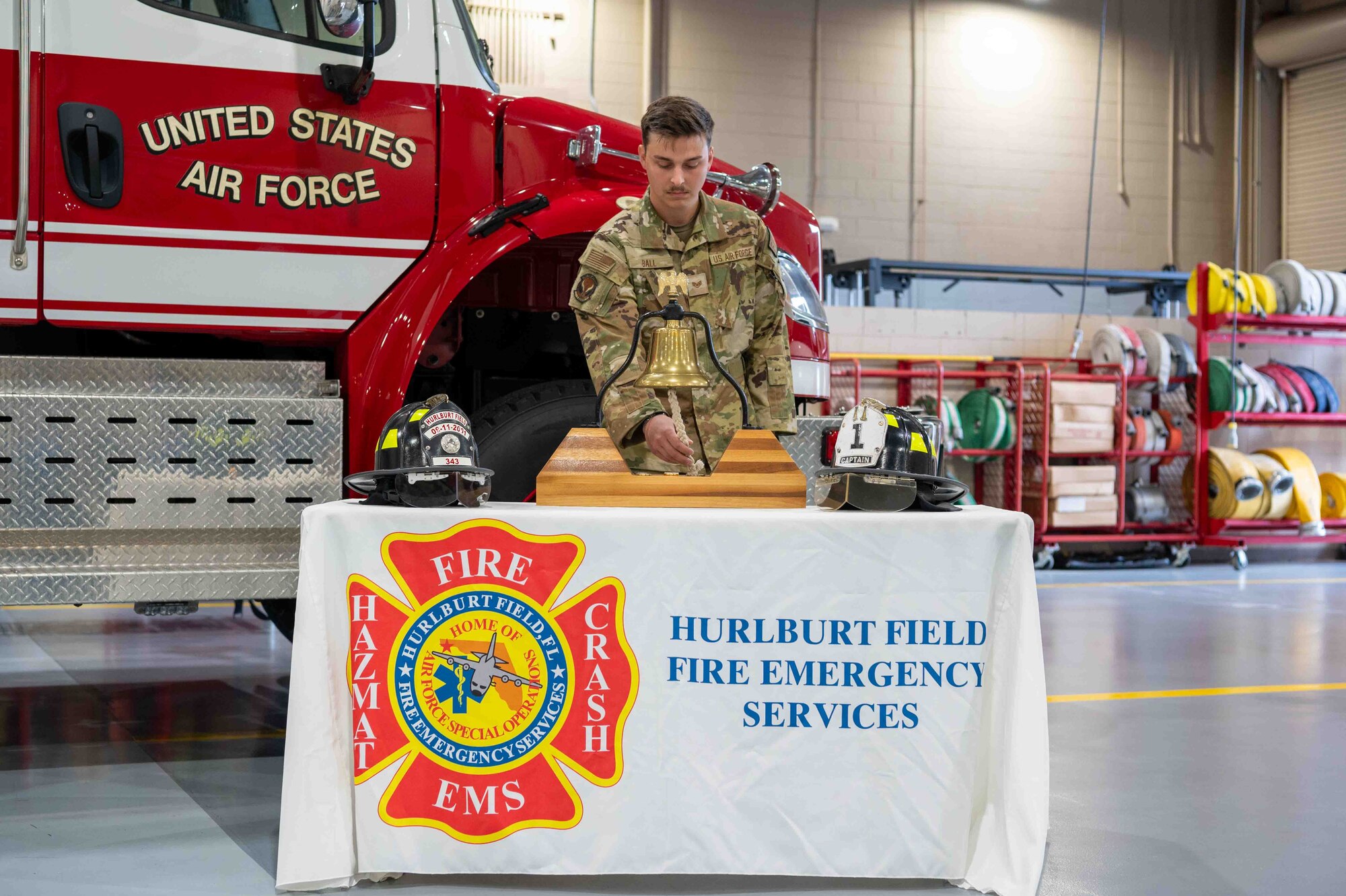 U.S. Air Force Staff Sgt. Dakota Ball, a 1st Special Operations Civil Engineer Squadron firefighter, rings a bell during a 9/11 remembrance ceremony on Hurlburt Field, Florida, Sept. 11, 2024.