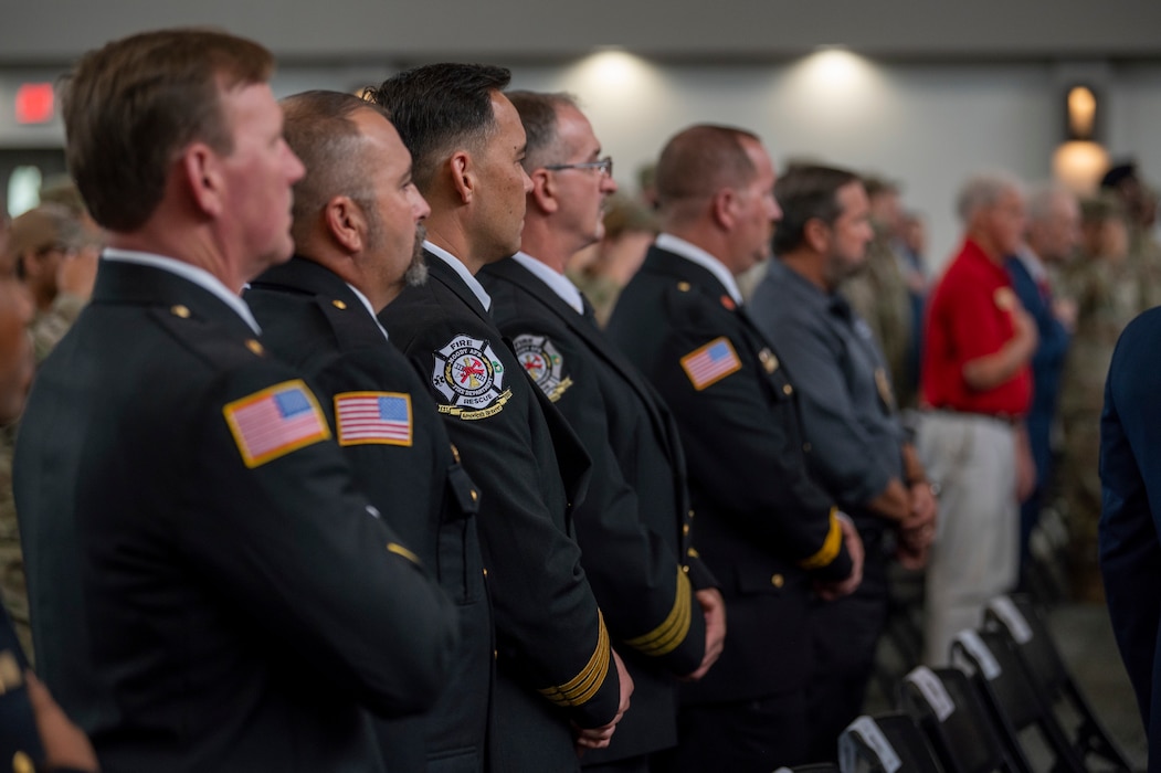 Firefighters assigned to the 23rd Civil Engineer Squadron stand at a 9/11 remembrance ceremony at Moody Air Force Base, Georgia, Sept. 11, 2024. The ceremony was held to remember the first responders who sacrificed their lives Sept. 11, 2001. (U.S. Air Force photo by Senior Airman Leonid Soubbotine)