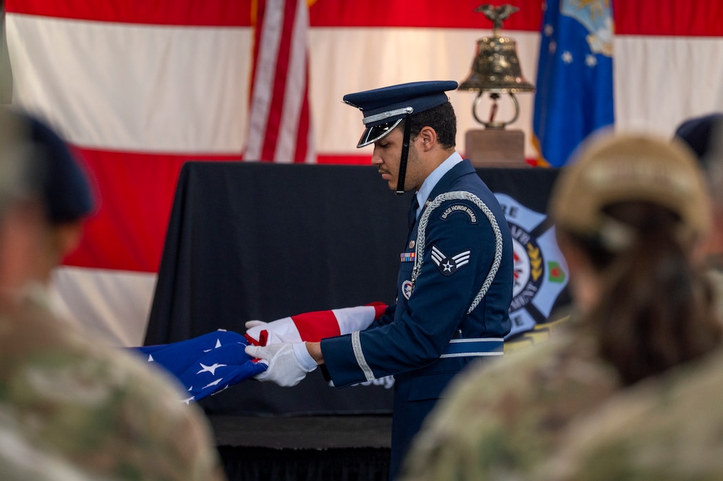 A U.S. Air Force Airman from the Moody Air Force Base honor guard unfolds the American flag in a retirement of colors during a 9/11 remembrance ceremony at Moody Air Force Base, Georgia, Sept.11, 2024. The ceremony was held to honor the first responders who lost their lives during the Sept. 11, 2001, terrorist attacks. (U.S. Air Force photo by Senior Airman Leonid Soubbotine)