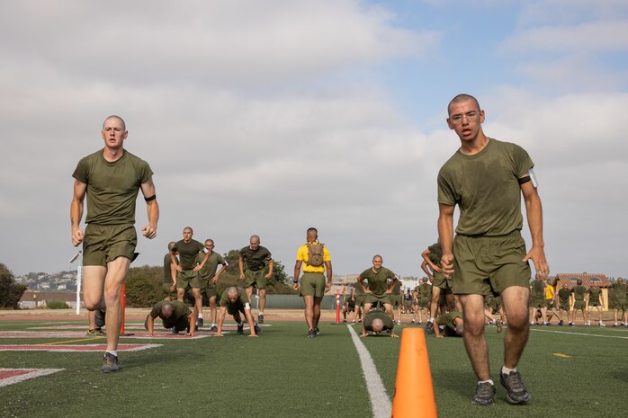 U.S. Marine Corps recruits with Hotel Company, 2nd Recruit Training Battalion, execute a sprint portion during a physical training session at Marine Corps Recruit Depot San Diego, California, Aug. 27, 2024. The recruits conducted a series of stations such as side shuffles, ammunition can lifts, planks, single-leg Romanian deadlifts, bicycle crunches, and 440-yard sprints during their physical training event strengthening themselves physically and mentally. (U.S. Marine Corps photo by Lance Cpl. Janell B. Alvarez)