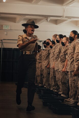 U.S. Marine Corps SSgt. Gaelle Juste, a drill instructor with Golf Company, 2nd Recruit Training Battalion, gives instructions to new recruits on pick up day, at Marine Corps Recruit Depot San Diego, California, Sep. 7, 2024. Pick up day signifies the first day of training in which recruits meet their drill instructor team for the first time, prepare their gear and squad-bay, and expectations are set for the remainder of their time in recruit training. (U.S. Marine Corps photo by Cpl. Alexander O. Devereux)