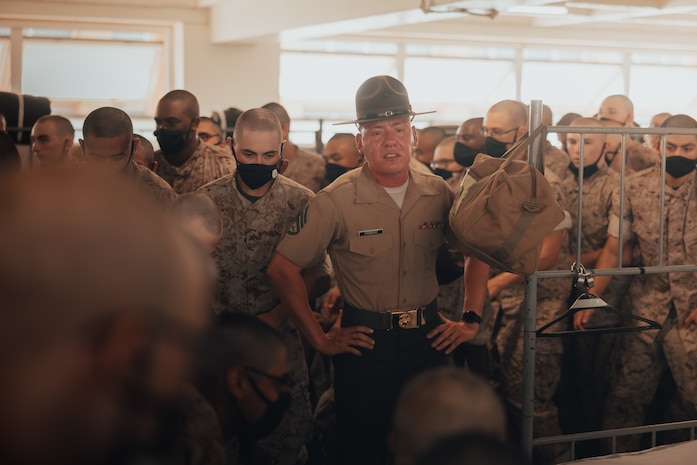 U.S. Marine Corps Staff Sgt. Jonothan Harbert, a drill instructor with Golf Company, 2nd Recruit Training Battalion, gives instructions to new recruits on pick up day, at Marine Corps Recruit Depot San Diego, California, Sep. 7, 2024. Pick up day signifies the first day of training in which recruits meet their drill instructor team for the first time, prepare their gear and squad-bay, and expectations are set for the remainder of their time in recruit training. (U.S. Marine Corps photo by Cpl. Alexander O. Devereux)