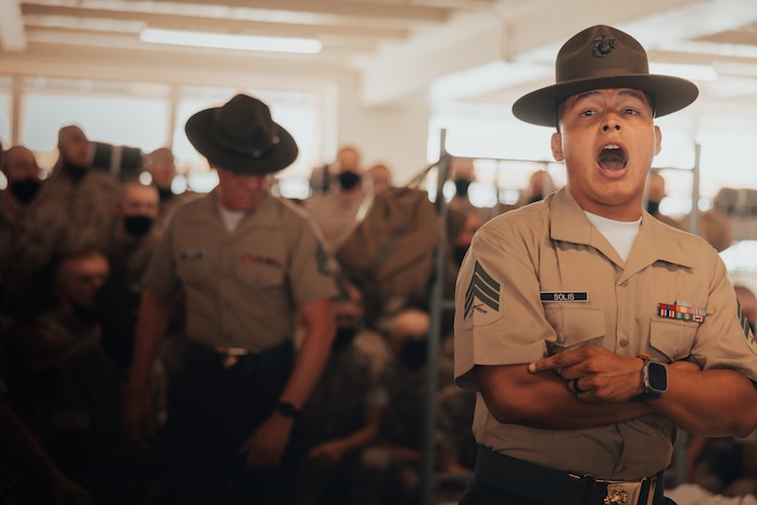 U.S. Marine Corps Sgt. Jamie Solis, a drill instructor with Golf Company, 2nd Recruit Training Battalion, gives instructions to new recruits on pick up day, at Marine Corps Recruit Depot San Diego, California, Sep. 7, 2024. Pick up day signifies the first day of training in which recruits meet their drill instructor team for the first time, prepare their gear and squad-bay, and expectations are set for the remainder of their time in recruit training. (U.S. Marine Corps photo by Cpl. Alexander O. Devereux)