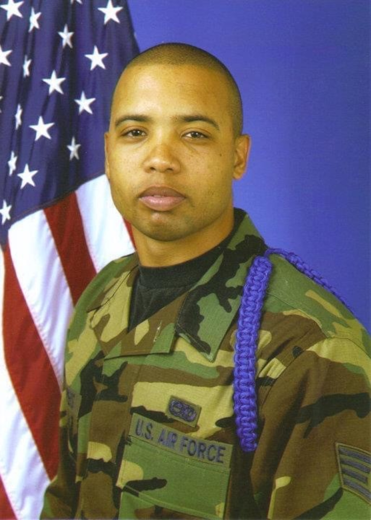 Service-member poses for a portrait.