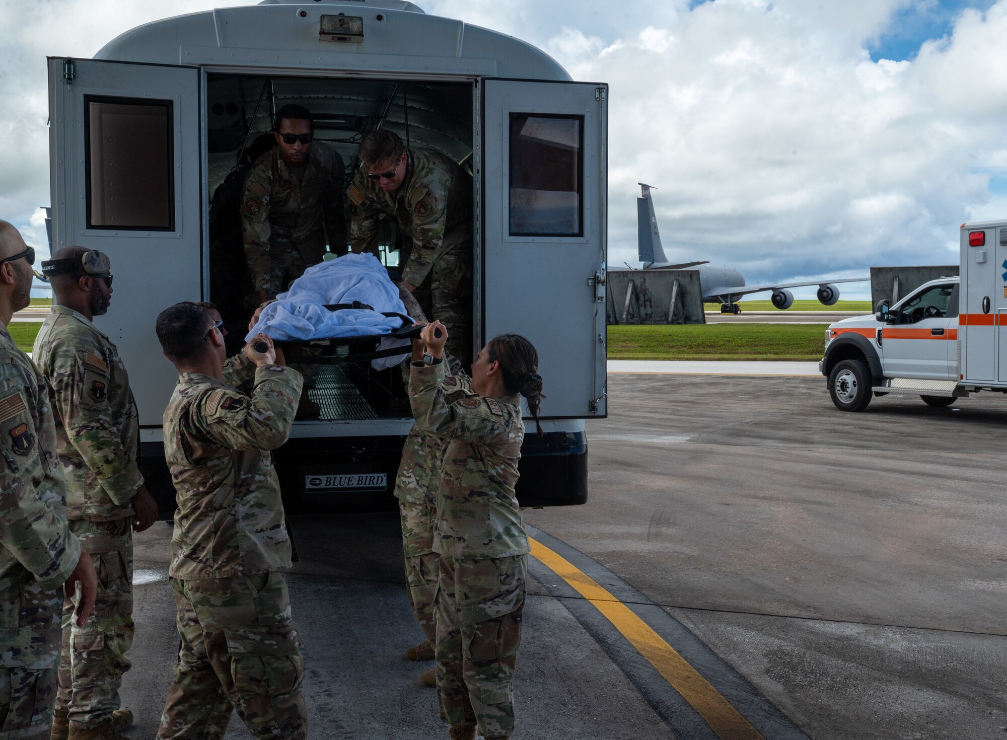 U.S. Air Force Airmen from the 36th Medical Group practice offloading simulated patients from the ambulance bus and loading to stations for a fixed wing air evacuation exercise on Andersen Air Force Base, Guam, Sep. 6, 2024. The training provided 36th MDG Airmen with hands-on training of airlift and aeromedical evacuation tactics. Skills invaluable to saving lives in both wartime and peacetime operations. (U.S. Air Force photo by Airman 1st Class Manasseh Demissie)