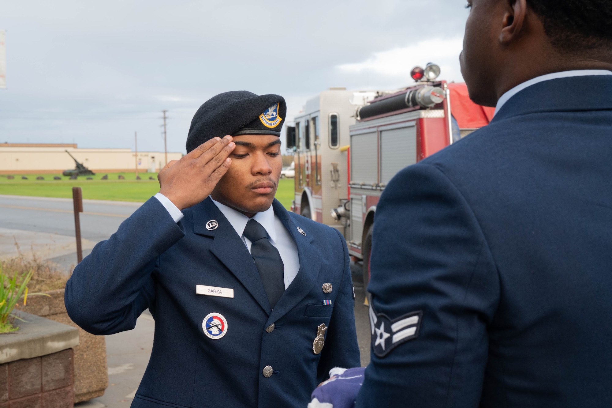 U.S. Air Force Airman 1st Class Patrick Garza, 354th Security Forces Squadron entry controller, salutes an American flag during a 9/11 remembrance ceremony at Eielson Air Force Base, Alaska, Sept. 11, 2024.