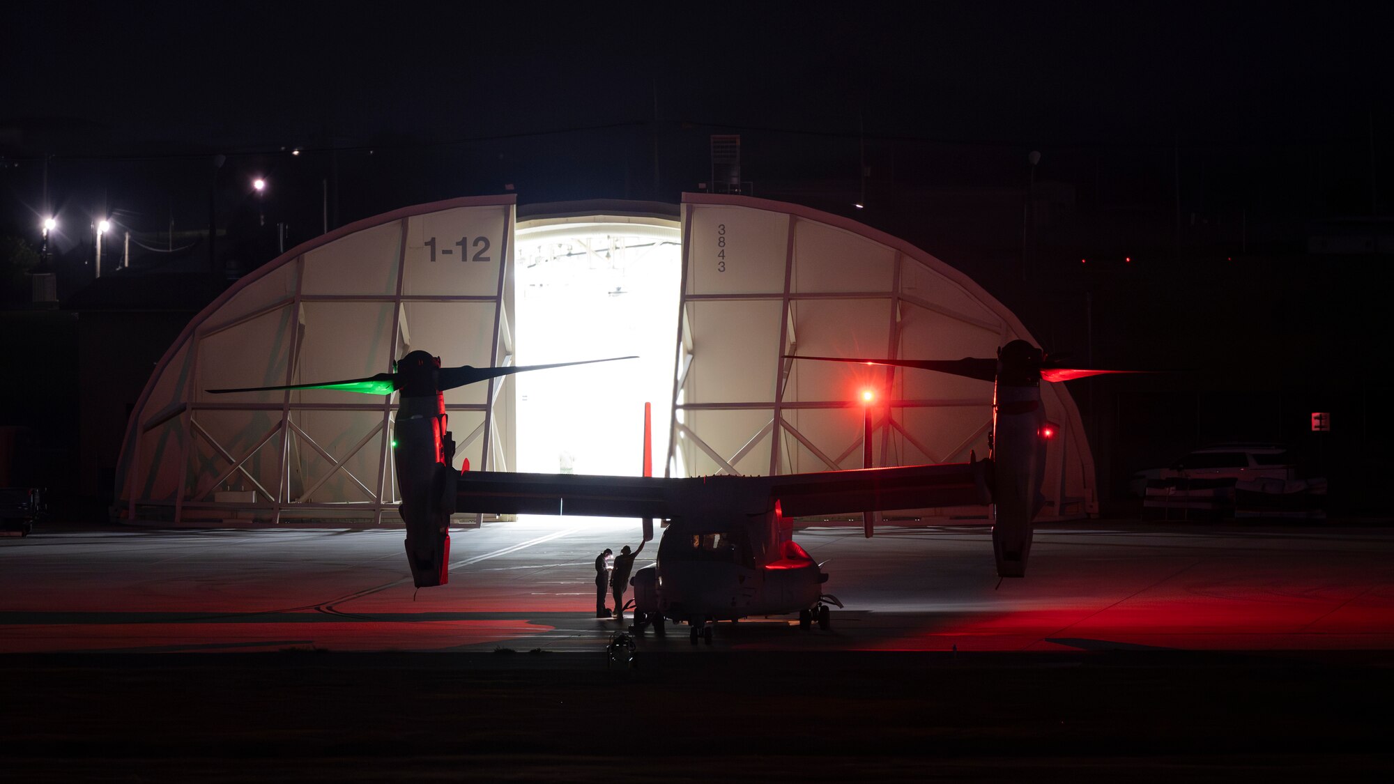 A U.S. Marine Corps MV-22B Osprey assigned to the Marine Medium Tilt Rotor Squadron (VMM) 165, lies parked on the flight line at Kunsan Air Base, Republic of Korea.