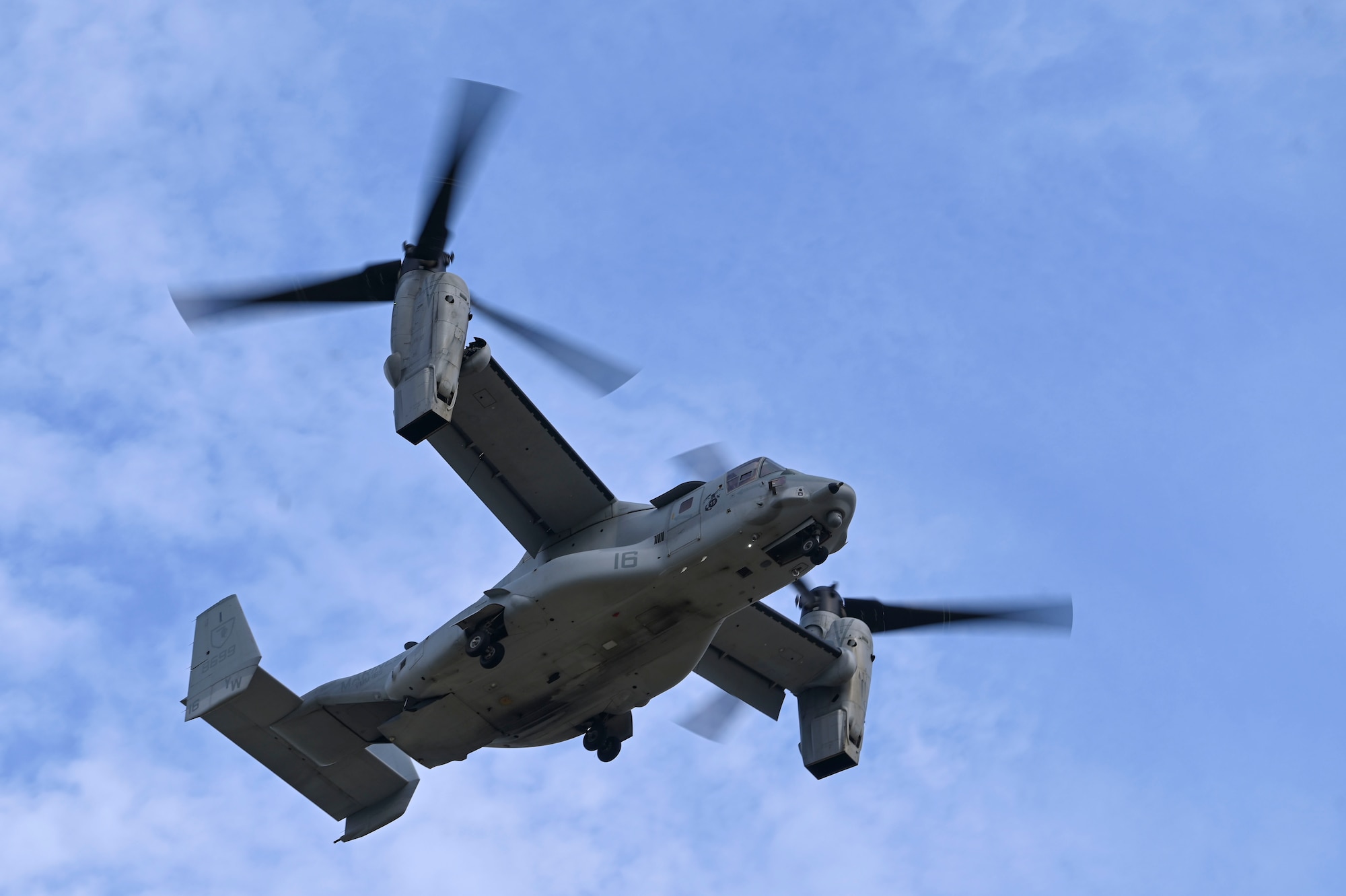 A U.S. Marine Corps MV-22B Osprey assigned to the Marine Medium Tiltrotor Squadron (VMM) 165, flies overhead at Kunsan Air Base, Republic of Korea.