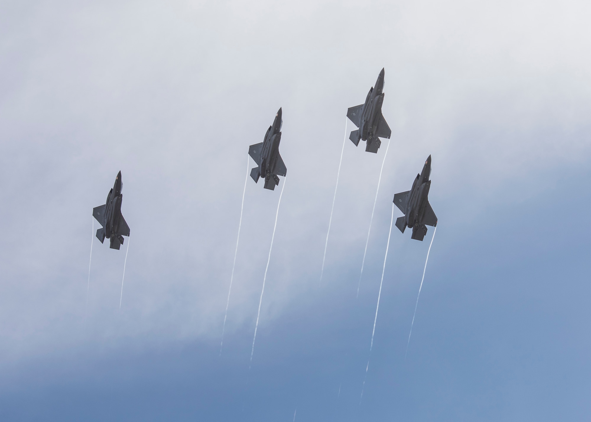 A photo of four F-35s flying in formation