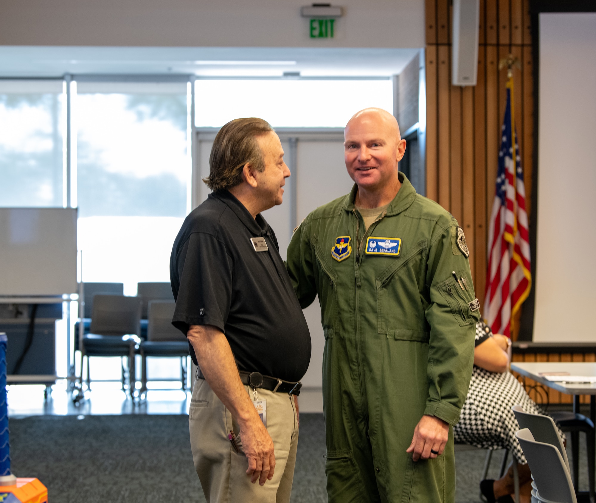U.S. Air Force Col. David Berkland (right), 56th Fighter Wing commander, speaks with Joe Pizzillo (left), City of Goodyear mayor, during the Air Force Community Partnership Program meeting at Estrella Mountain Community College, Avondale, Arizona, Sept. 10, 2024.