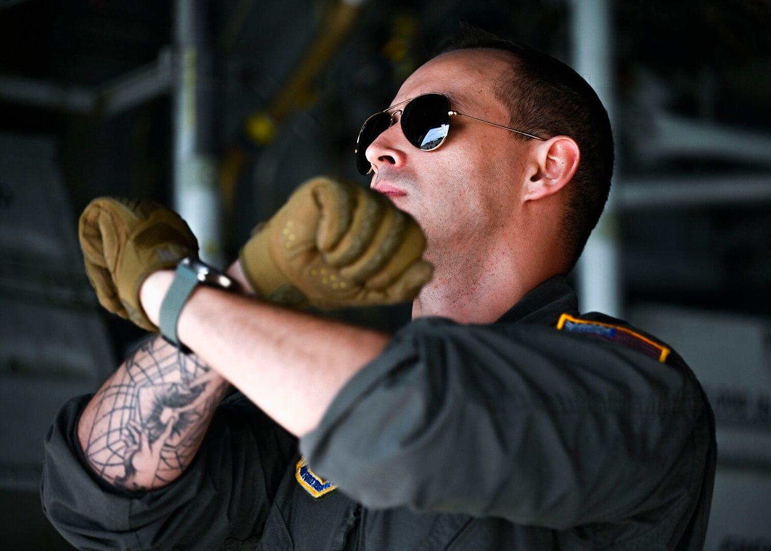 A member from the 302nd Airlift Wing signals to Airmen on the flightline at Peterson Space Force Base, Colorado, Sept. 4, 2024. The 21st Medical Group and 21st Security Forces Squadron partnered with the 302nd AW to practice deployed medic skills. (U.S. Space Force photo by Staff Sgt. Natalie Rubenak)