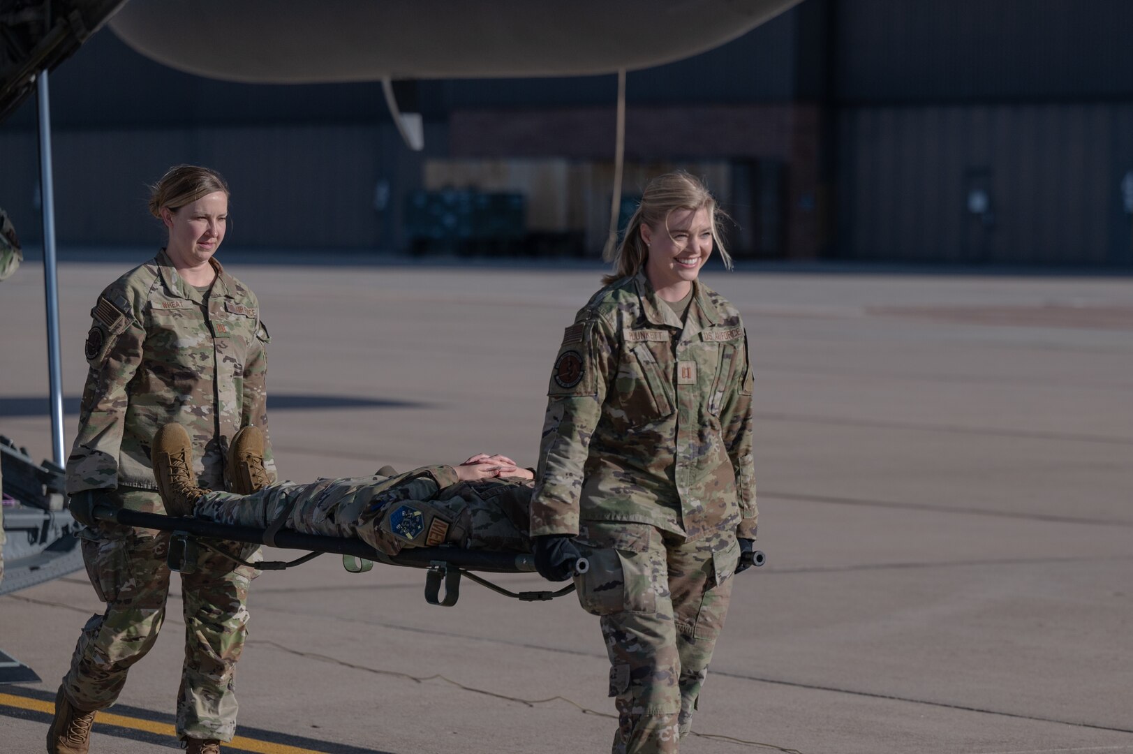 Members from the 21st Medical Group carry a medical stretcher during a training with the 302nd Airlift Wing at Peterson Space Force Base, Colorado, Sept. 4, 2024. The training gave medical airman a refresher on deployed medical skills, such as patient on-loading and off-loading from and aircraft. (U.S. Space Force photo by 2nd Lt. Jacob Willoughby)