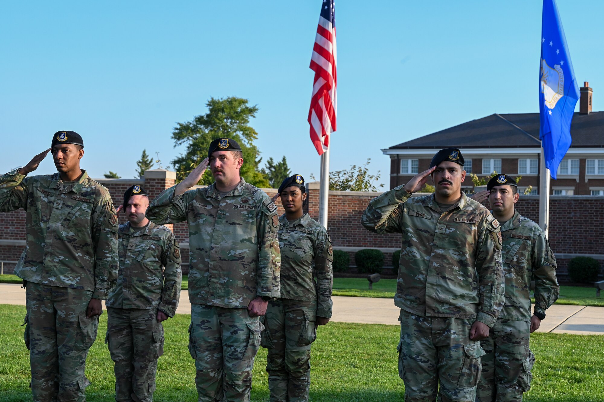 U.S. Air Force service members from the 11th Security Forces Squadron on Joint Base Anacostia-Bolling salute during the national anthem during the Remembrance Ceremony on JBAB, Washington, D.C., Sept. 11, 2024. The ceremony marked the 23rd anniversary of the 9/11 attacks. Attendees reflected on the impact of the day and honored the nearly 3,000 people who lost their lives. (U.S. Air Force photo by Airman 1st Class Shanel Toussaint)