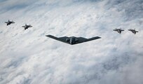 A U.S. Air Force B-2 Spirit stealth bomber and four Japan Air Self-Defense Force F-35A Lightning IIs, fly in formation over the Indo-Pacific area of responsibility, Sept. 10, 2024. Bomber missions provide opportunities to train and work with our Allies and partners in joint and coalition operations and exercises. (U.S. Air Force photo by Senior Airman Samantha White)