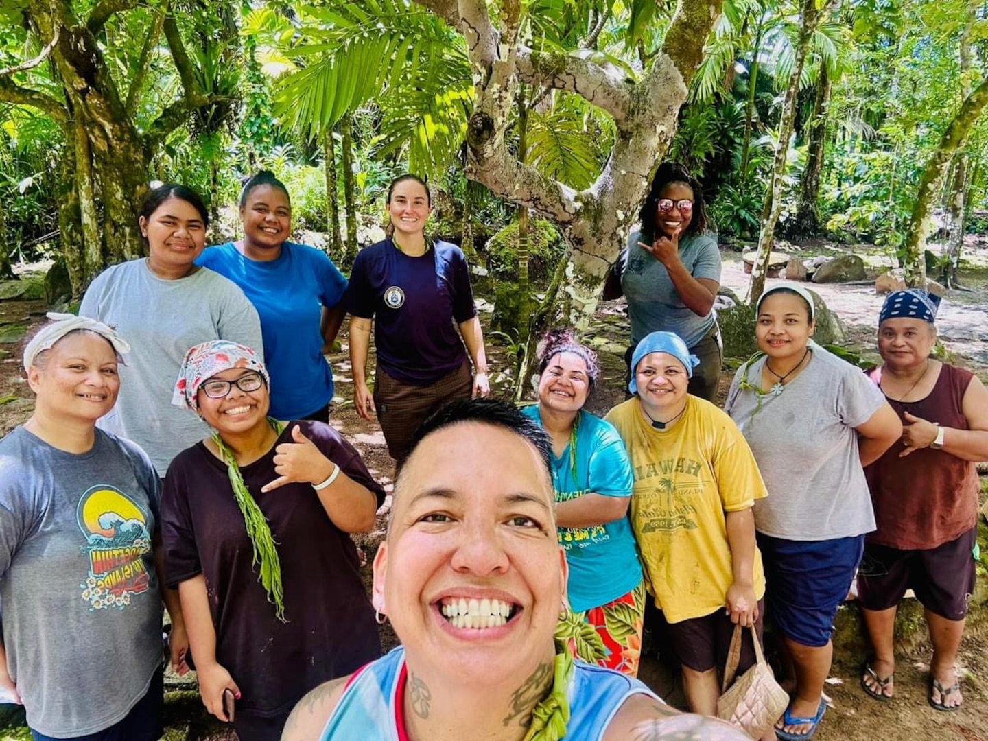 U.S. Coast Guard members, including Dee Cruz from the Emergency Management team, Lt. Kira Adams from the Joint Rescue Sub-Center in Guam, and Lt. Anna Maria Vaccaro, the Compact of Free Association (COFA) Liaison, assist with a quarterly village clean-up in Yap, Federated States of Micronesia, led by local families, showcasing the strong community ties developed during the mission on Sept. 7, 2024. In addition to the EOC and ICS introduction workshop, U.S. Coast Guard personnel engaged with the community by providing boating safety workshops and participating in local cultural activities, reflecting the deep commitment to fostering enduring partnerships. (U.S. Coast Guard photo by Dee Cruz)