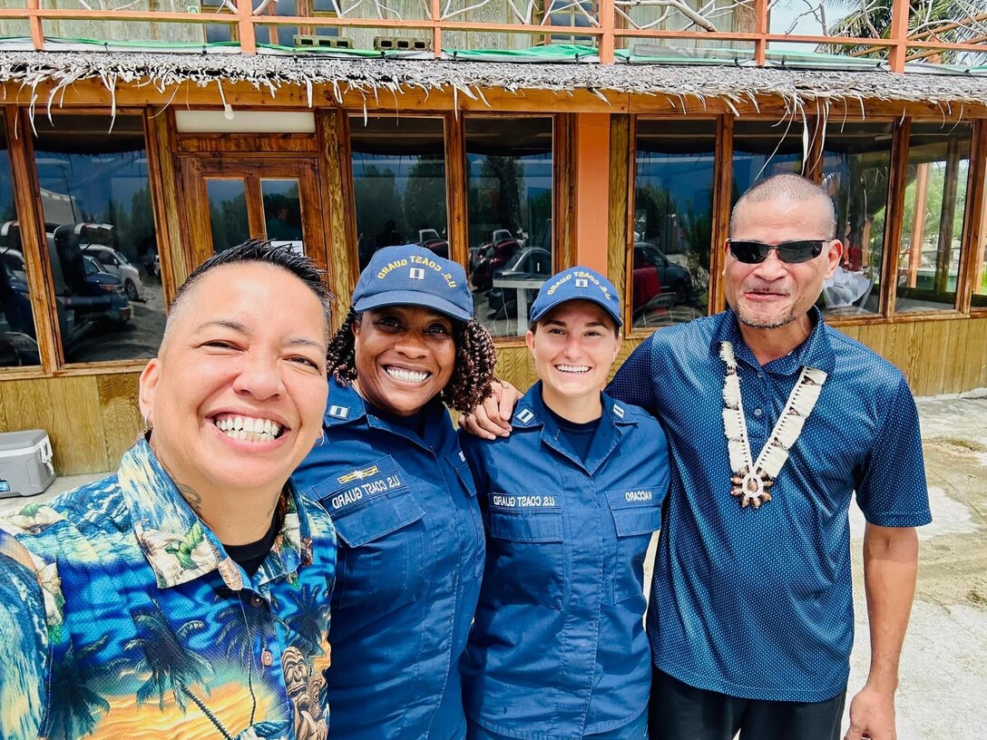 U.S. Coast Guard instructors, including Dee Cruz from the Emergency Management team, Lt. Kira Adams from the Joint Rescue Sub-Center in Guam, and Lt. Anna Maria Vaccaro, the Compact of Free Association (COFA) Liaison, take a moment for a photo with Senator Victor Bamog who catered lunch for the disaster preparedness and response workshop on Sept. 6, 2024. The workshop focused on the activation, staffing, organization, deactivation, and demobilization of an Emergency Operations Center (EOC), offering Yapese partners crucial insights into managing disaster response. (U.S. Coast Guard photo by Dee Cruz)