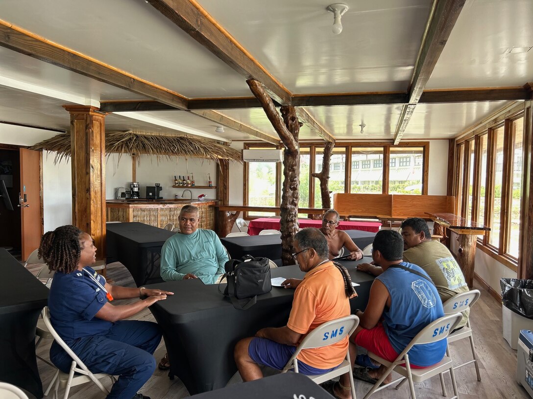 Lt. Kira Adams from the Joint Rescue Sub-Center in Guam leads a safe boating workshop with community members from Woleai Atoll in Colonia, Yap, Federated States of Micronesia, on Sept. 8, 2024.  U.S. Coast Guard personnel engaged with the community by providing boating safety workshops and participating in local cultural activities, reflecting the deep commitment to fostering enduring partnerships. (U.S. Coast Guard photo by Lt. Anna Maria Vaccaro)