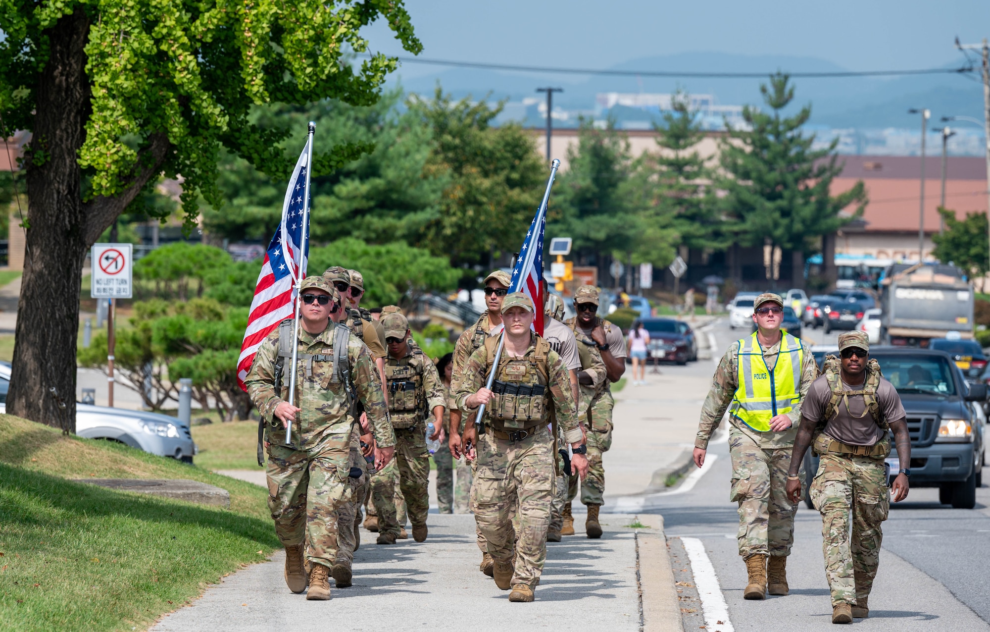U.S. Air Force Airmen assigned to the 51st Fighter Wing, ruck in remembrance of 9/11 at Osan Air Base, Republic of Korea, Sept. 11, 2024. The Airmen rucked four miles to honor the lives of the fallen. (U.S. Air Force photo by Staff Sgt. Christopher Tam)