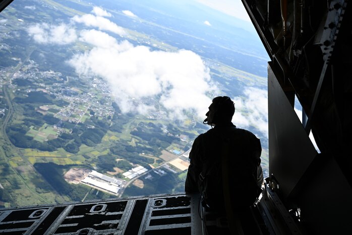 U.S. Air Force Senior Airman Tristan Desnerck, 1st Special Operations Squadron loadmaster, sits at the edge of a C-130 Hercules during Misawa Air Fest 2024 at Misawa Air Base, Japan, Sept. 8, 2024.