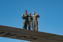 U.S. Air Force aircrew members pose for a photo on top of a C-130 (find the full name in the DOD style guide) during Misawa Air Fest at Misawa Air Base, Japan, Sept. 8, 2024.