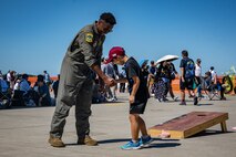 A U.S. Air Force member shakes hands with a Japanese boy during Misawa Air Fest at Misawa Air Base, Japan, Sept. 8, 2024.