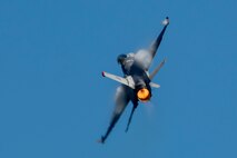 An F-16 Fighting Falcon performs an aerial display during Air Fest 2024