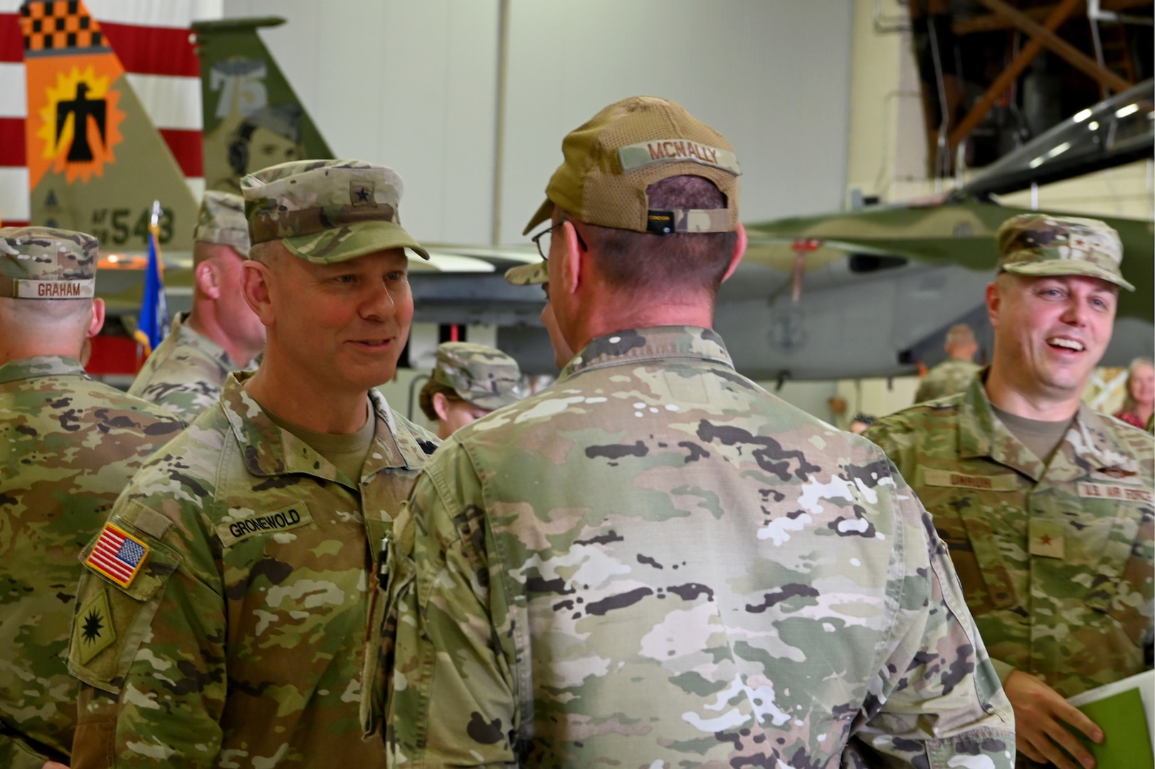 U.S. Army Brig. Gen. Alan Gronewold, Oregon National Guard adjutant general, speaks with Tech. Sgt. Peter McNally, 173rd Logistics Readiness Squadron, after a mobilization ceremony at Kingsley Field in Klamath Falls, Oregon, Sept. 8, 2024.