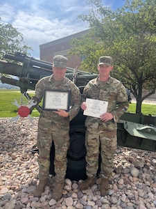 Staff Sgts. Ian Wilding, Delta Company 141st Brigade Support Battalion and Chris Yoder, Fox Company 181st Brigade Support Battalion, show off their awards following the 2024 National Guard Best Mechanic of the Year competition at Camp Williams, Utah, Aug. 25, 2024. Wilding took top honors; Yoder finished fourth out of 26 competitors.