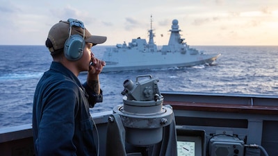 USS Russell (DDG 59) is underway with the Italian navy  frigate ITS Alpino (F 594) in the South China Sea.