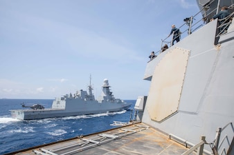 USS Russell (DDG 59) is underway with the Italian navy aircraft carrier ITS Cavour (CV 550) in the South China Sea.