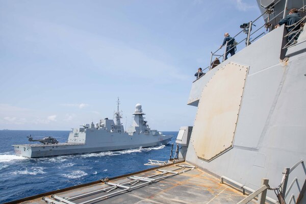 USS Russell (DDG 59) is underway with the Italian navy aircraft carrier ITS Cavour (CV 550) in the South China Sea.