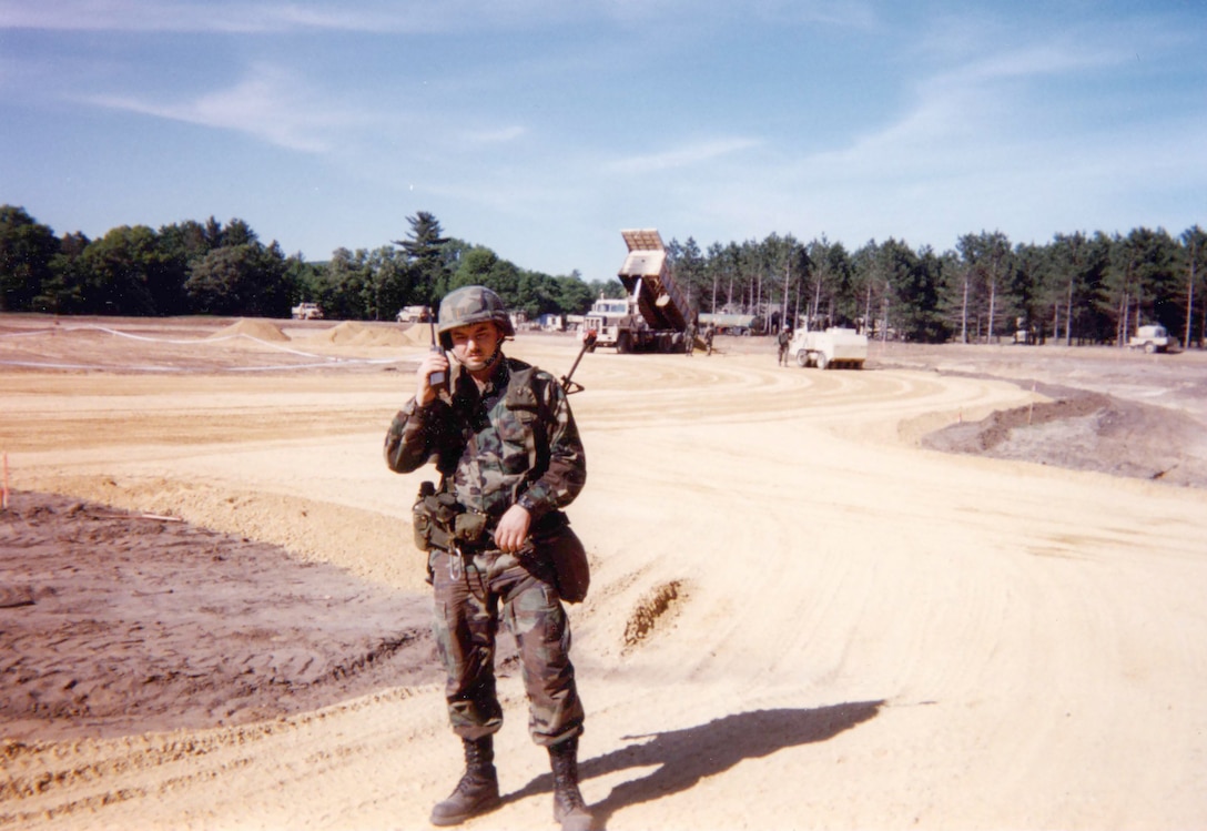 1st. Lt. Dominic Anderson, a platoon leader with the Wisconsin Army National Guard’s 229th Engineer Company in Platteville, Wis., communicates on the site of a local training area in 1995. The unit was involved in numerous projects today referred to as innovative readiness training, such as athletic fields, campsites and parking pads for military fuel tankers. Photo courtesy of Jeff Breuer