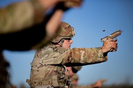 Oklahoma Army National Guard Spc. Darin Carney fires an M17 Pistol during the 2024 Governor's 20 Marksmanship Competition, Sept. 8, 2024, at Camp Gruber Training Center, Oklahoma. The Oklahoma National Guard Governor’s 20 is an annual competition where Oklahoma Army and Air National Guardsmen compete in a series of shooting events to showcase the Oklahoma National Guard’s top marksmen. (Oklahoma National Guard photo by Sgt. Haden Tolbert)