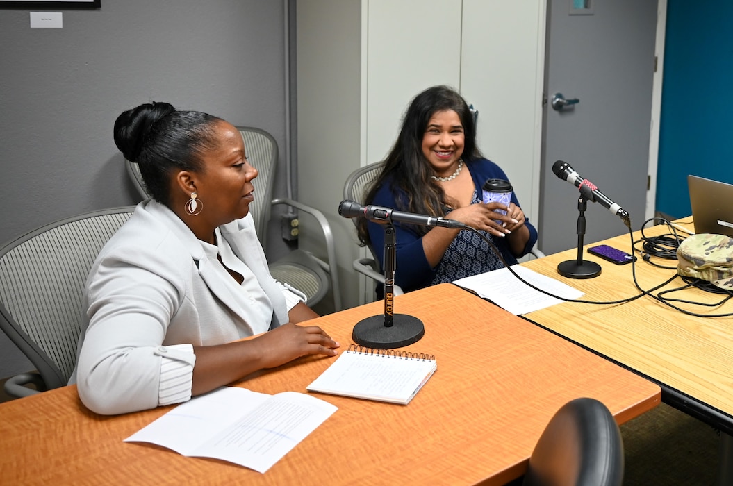 Leticia Gonzalez, 433rd Airlift Wing Military and Family Readiness program manager, sits alongside Nakia Evans, Magellan Federal personal financial counselor, to discuss a food pantry program launching for military members and their extended family.