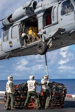 HSC-25 participates in vertical replenishment training aboard USS America (LHA 6).