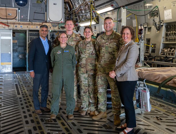 U.S. Air Force Airmen stand for a photo with the Honorable Ashish Vazirani