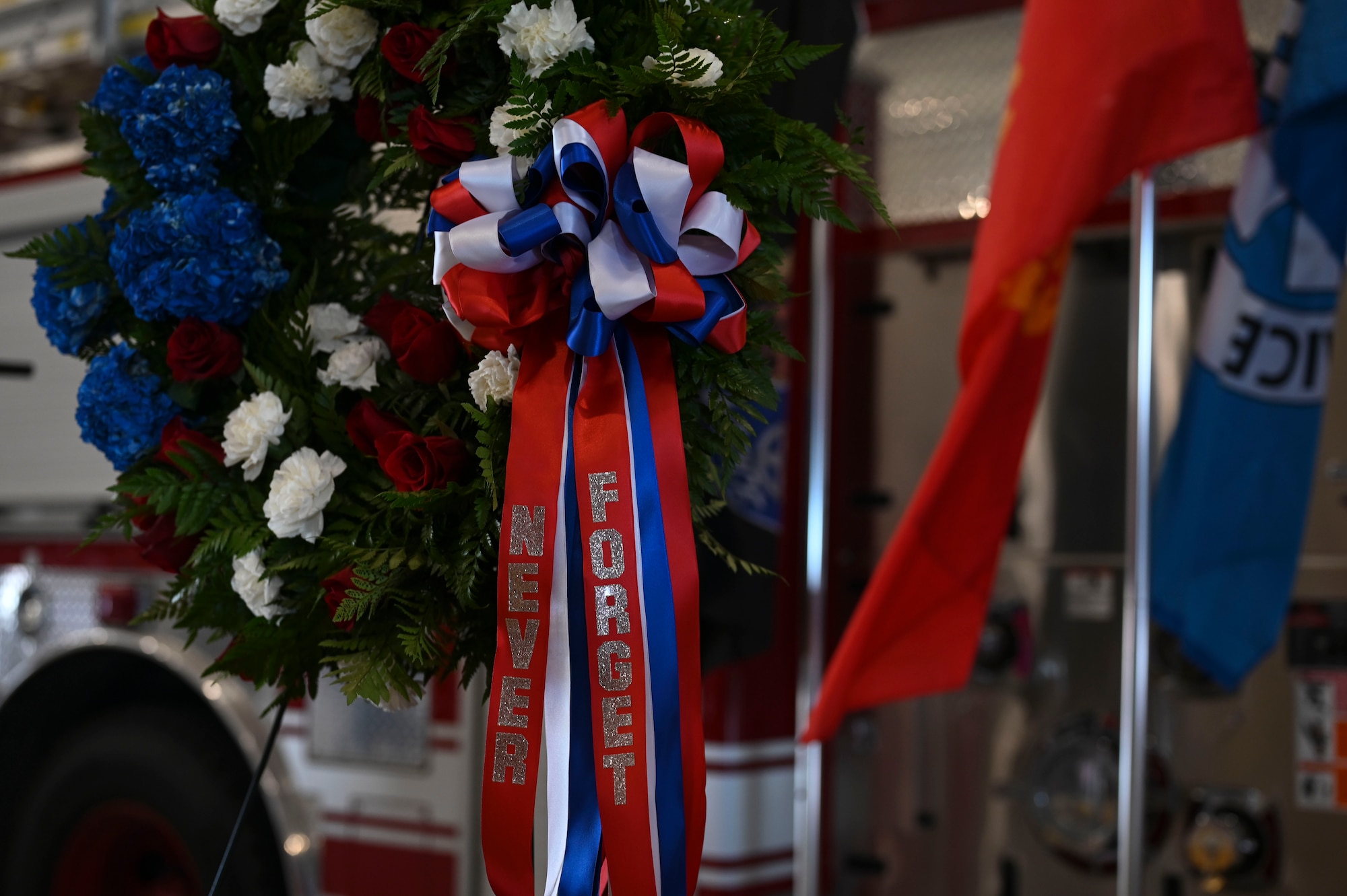 A wreath sits on display during the 9/11 ceremony at the Louis F. Garland Department of Defense Fire Academy, Goodfellow Air Force Base, Texas, September 11, 2024. The 312th Training Squadron brought service members together at the Louis F. Garland Department of Defense Fire Academy to honor the heroes and victims of the Sept. 11, 2001, terrorist attacks. (U.S. Air Force photo by Airman 1st Class Madi Collier)