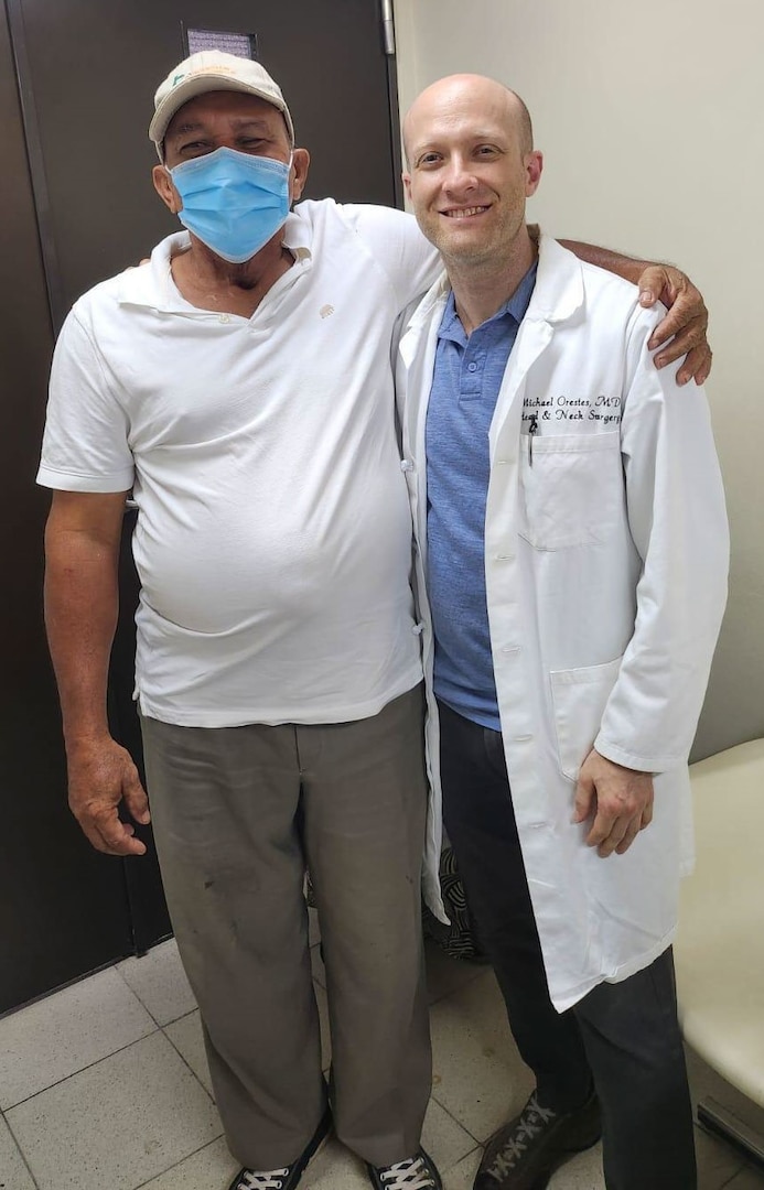 U.S. Army Lt. Col. (Dr.) Michael Orestes, Residency Program Director and Otolaryngology Consultant to the Surgeon General, visits with a patient who underwent a successful total laryngectomy during a two-week humanitarian and readiness mission in Honduras Aug. 17-31.