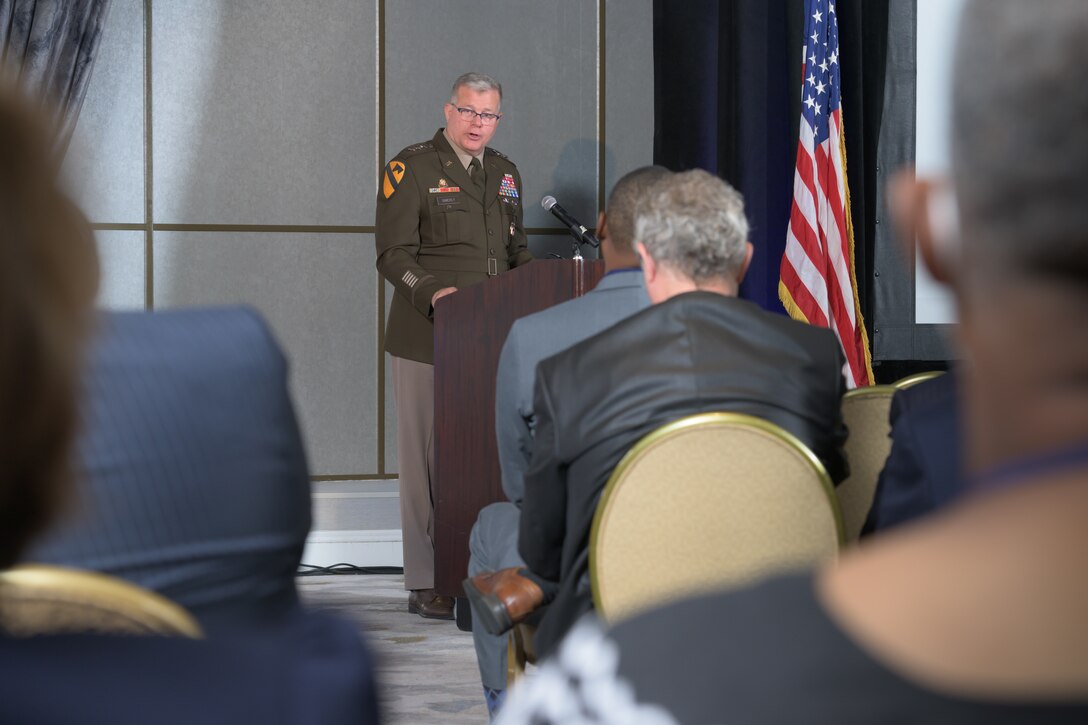 Lt. Gen Mark Simerly standing at podium