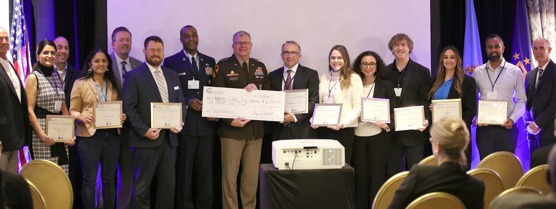 Group of people holding awards.