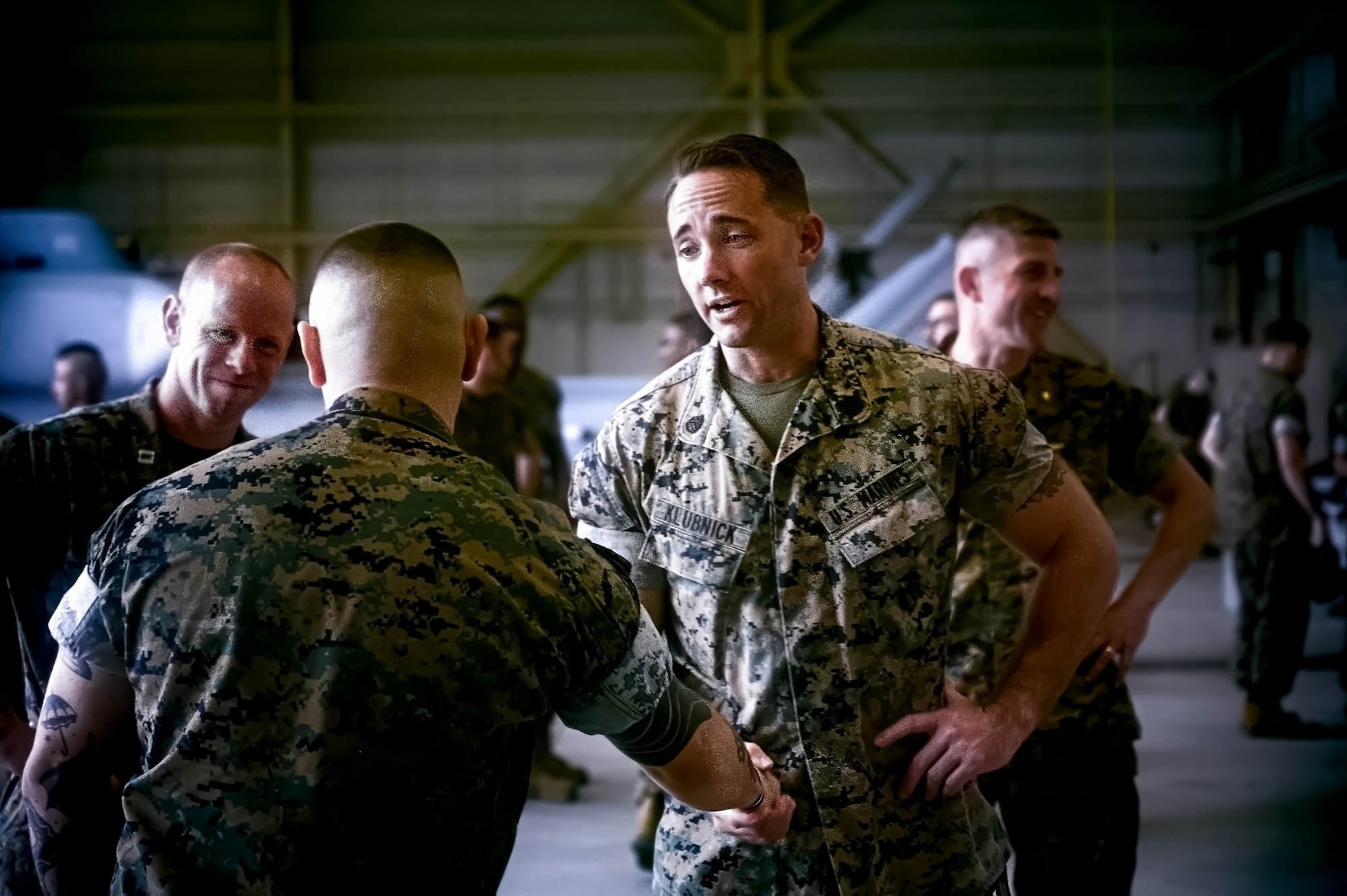 U.S. Marine Corps Sgt. Andrew Gomez, Marine Aircraft Group 49 aviation supply specialist, greets Marines after an award ceremony at Joint Base McGuire-Dix-Lakehurst, N.J., Aug. 14, 2024. Gomez received the Navy and Marine Corps Medal for extricating a passenger from a burning vehicle on June 19, 2023. (U.S. Air Force photo by Senior Airman Matt Porter)